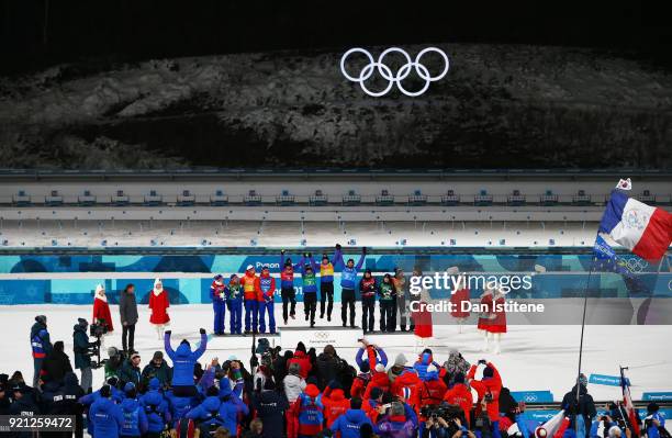 Silver medalists Marte Olsbu, Tiril Eckhoff, Johannes Thingnes Boe and Emil Hegle Svendsen of Norway, gold medalists Marie Dorin Habert, Anais...