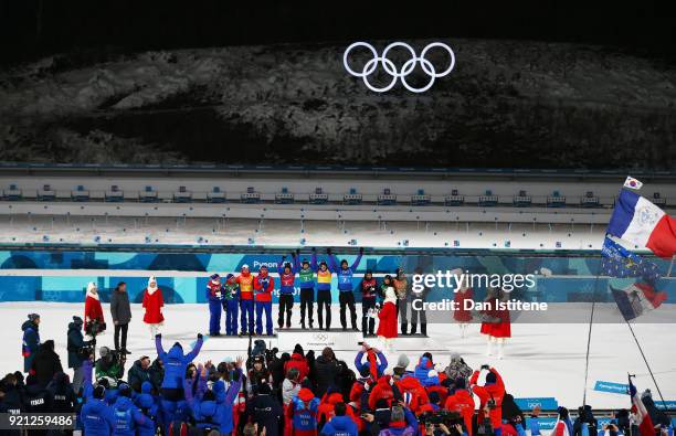 Silver medalists Marte Olsbu, Tiril Eckhoff, Johannes Thingnes Boe and Emil Hegle Svendsen of Norway, gold medalists Marie Dorin Habert, Anais...