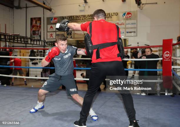 Carl Frampton works out with trainer Jamie Moore during a media work out session at on February 20, 2018 in Manchester, England.