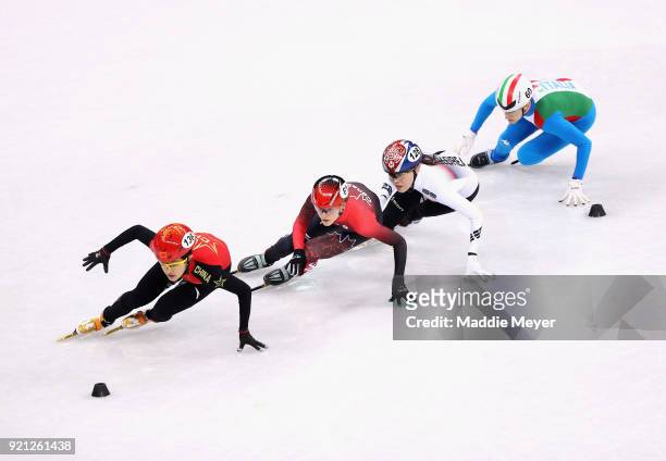 Kexin Fan of China, Kim Boutin of Canada, Sukhee Shim of Korea and Martina Valcepina of Italy compete the Ladies Short Track Speed Skating 3000m...
