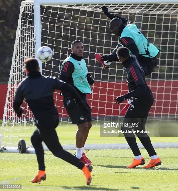 Antonio Valencia, Anthony Martial and Eric Bailly of Manchester United in action during a first team training session at Aon Training Complex on...
