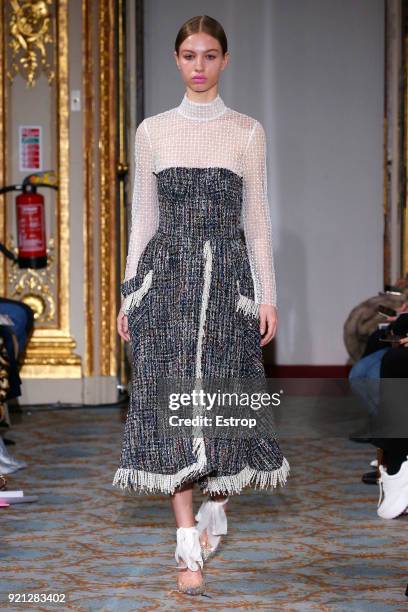 Model walks the runway at the Huishan Zhang show during London Fashion Week February 2018 at The Savile Club on February 18, 2018 in London, England.