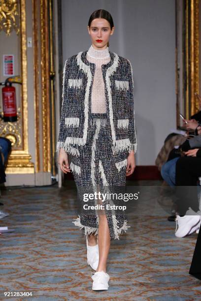 Model walks the runway at the Huishan Zhang show during London Fashion Week February 2018 at The Savile Club on February 18, 2018 in London, England.