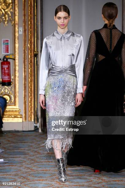 Model walks the runway at the Huishan Zhang show during London Fashion Week February 2018 at The Savile Club on February 18, 2018 in London, England.