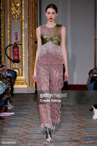 Model walks the runway at the Huishan Zhang show during London Fashion Week February 2018 at The Savile Club on February 18, 2018 in London, England.