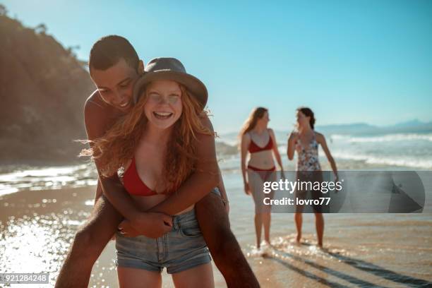 loving couple at the beach - summer of 77 stock pictures, royalty-free photos & images