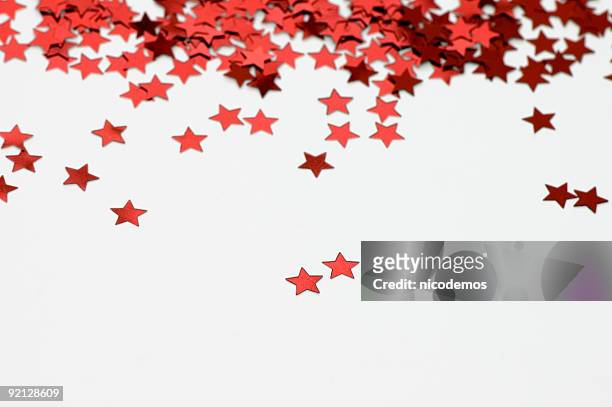 red star raining - star confetti white background stockfoto's en -beelden