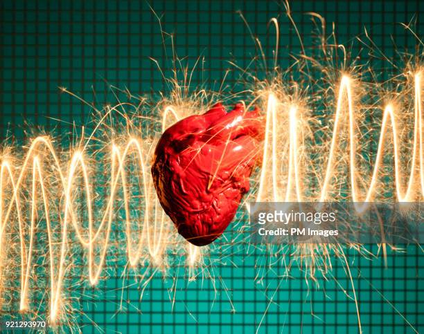human heart and electrical energy - heart attack stockfoto's en -beelden