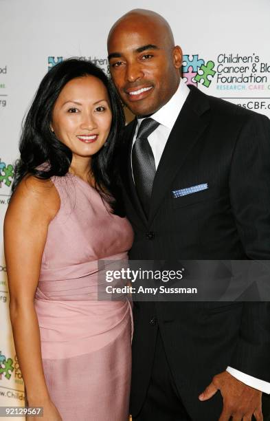 Sports broadcaster Tiki Barber and his wife Ginny Barber attend the "Breakthrough Ball" fundraising gala at The Plaza Hotel on October 20, 2009 in...
