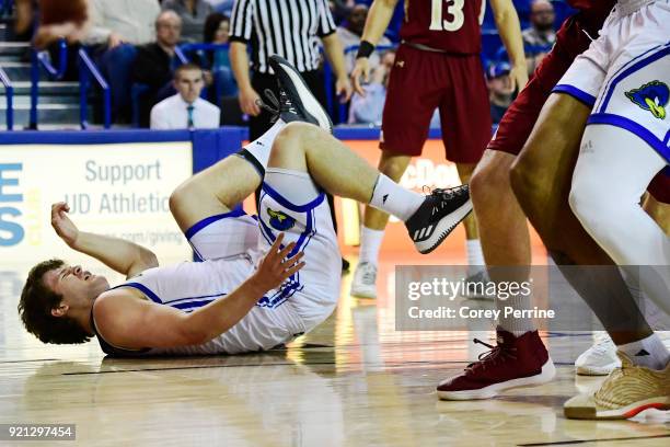 Ryan Daly of the Delaware Fightin Blue Hens hits the floor against the Elon Phoenix during the first half at the Bob Carpenter Center on February 17,...