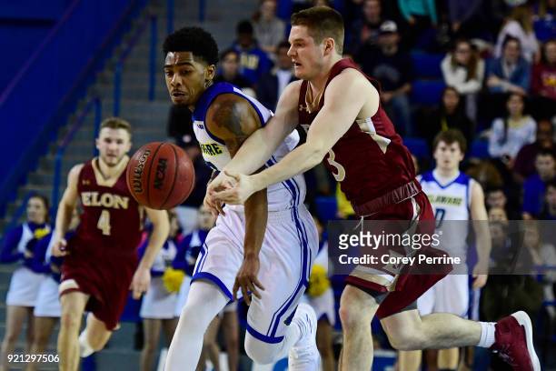 Anthony Mosley of the Delaware Fightin Blue Hens and Seth Fuller of the Elon Phoenix vie for the ball during the first half at the Bob Carpenter...