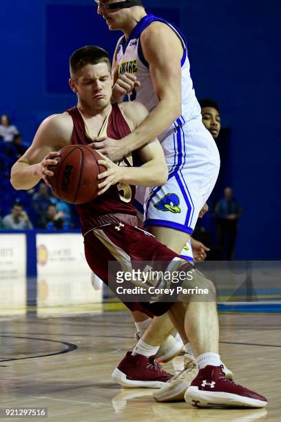 Seth Fuller of the Elon Phoenix runs into Jacob Cushing of the Delaware Fightin Blue Hens during the first half at the Bob Carpenter Center on...