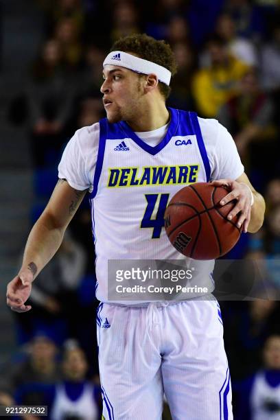 Darian Bryant of the Delaware Fightin Blue Hens dribbles against the Elon Phoenix during the first half at the Bob Carpenter Center on February 17,...