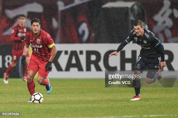 James Donachie of Melbourne Victory and Hulk of Shanghai SIPG compete for the ball during the 2018 AFC Champions League Group F match between...