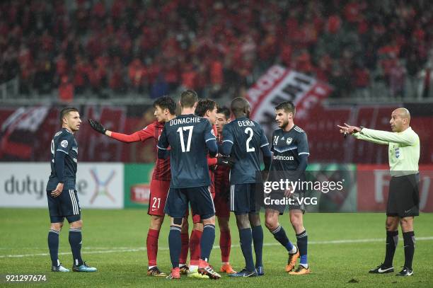 Referee and players in action during the 2018 AFC Champions League Group F match between Shanghai SIPG and Melbourne Victory at Shanghai Stadium on...