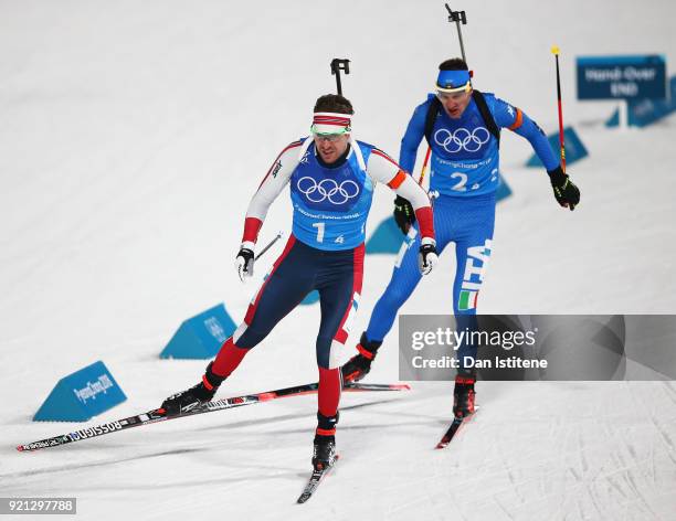 Emil Hegle Svendsen of Norway and Lukas Hofer of Italy compete during the Biathlon 2x6km Women + 2x7.5km Men Mixed Relay on day 11 of the PyeongChang...