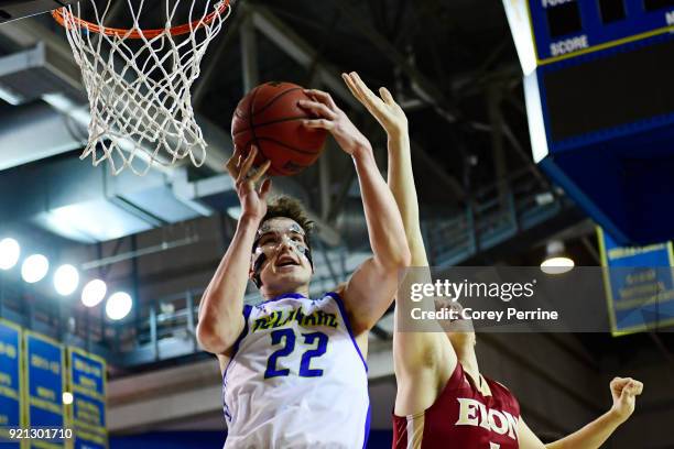Jacob Cushing of the Delaware Fightin Blue Hens out rebounds Duje Radja of the Elon Phoenix during the second half at the Bob Carpenter Center on...