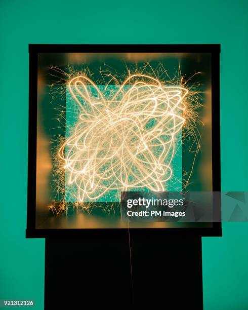 sparks flying around inside of box - spark creativity stock pictures, royalty-free photos & images