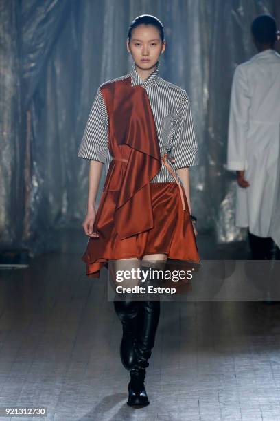 Model walks the runway at the palmer//harding show during London Fashion Week February 2018 at on February 18, 2018 in London, England.