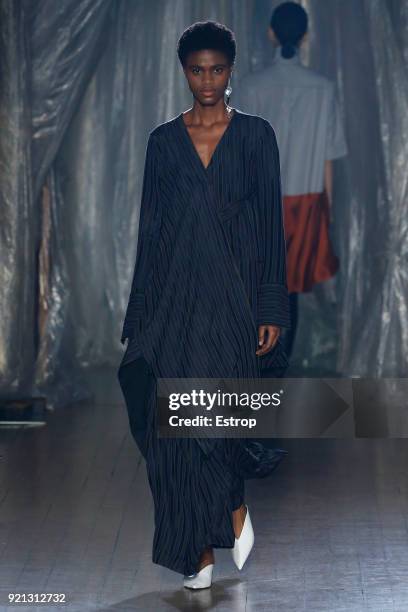 Model walks the runway at the palmer//harding show during London Fashion Week February 2018 at on February 18, 2018 in London, England.