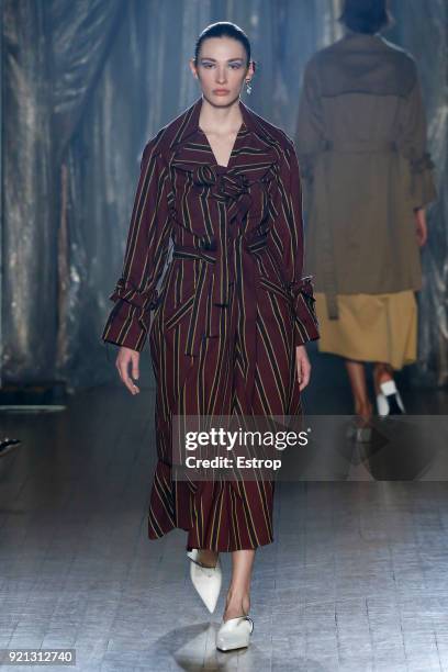 Model walks the runway at the palmer//harding show during London Fashion Week February 2018 at on February 18, 2018 in London, England.