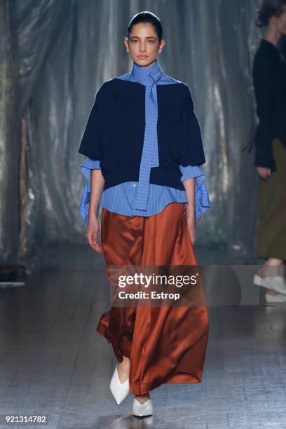 Model walks the runway at the palmer//harding show during London Fashion Week February 2018 at on February 18, 2018 in London, England.