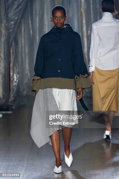 Model walks the runway at the palmer//harding show during London Fashion Week February 2018 at on February 18, 2018 in London, England.