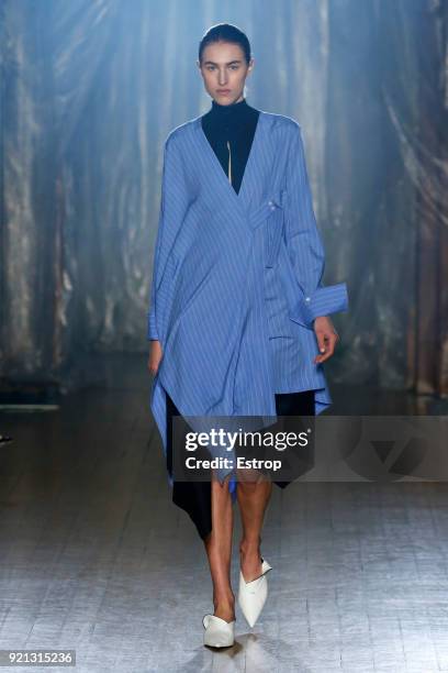 Model walks the runway at the palmer//harding show during London Fashion Week February 2018 at on February 18, 2018 in London, England.