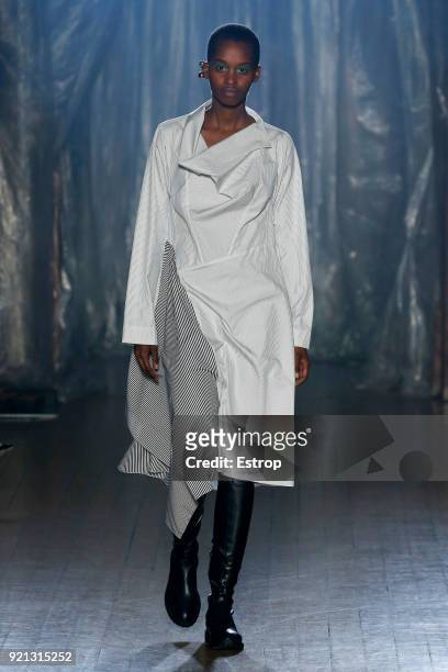 Model walks the runway at the palmer//harding show during London Fashion Week February 2018 at on February 18, 2018 in London, England.