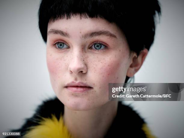 Model backstage ahead of the Shrimps Presentation during London Fashion Week February 2018 at TopShop Show Space on February 20, 2018 in London,...