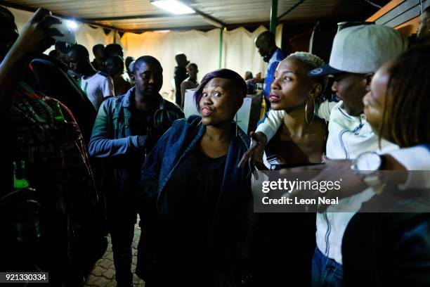 Young people socialise at the Boiketlong pub in the Tembisa township on March 27, 2017 in Johannesburg, South Africa. Those born since the collapse...