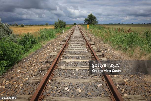 Empty rail road tracks lead to what was the opening in the Serbian-Hungarian border taken by thousands of migrants last year on July 16, 2016 in...