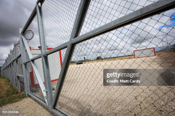 Padlock locks the gates of the old migrant reception centre on July 16, 2016 in Roszke, Hungary. Last summer thousands of refugees and migrants were...