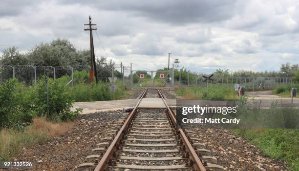Empty rail road tracks lead to what was the opening in the Serbian-Hungarian border taken by thousands of migrants last year on July 16, 2016 in...