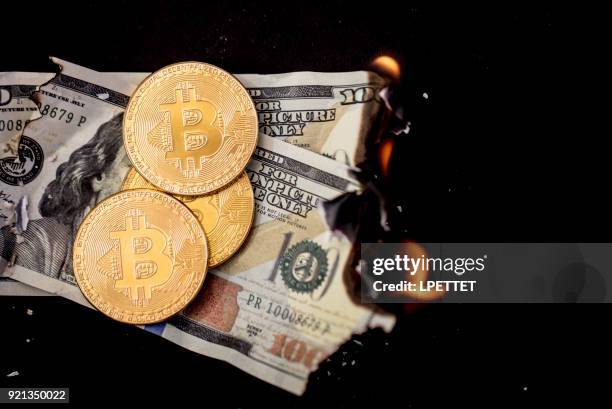 bitcoin on fire - burning stock pictures, royalty-free photos & images