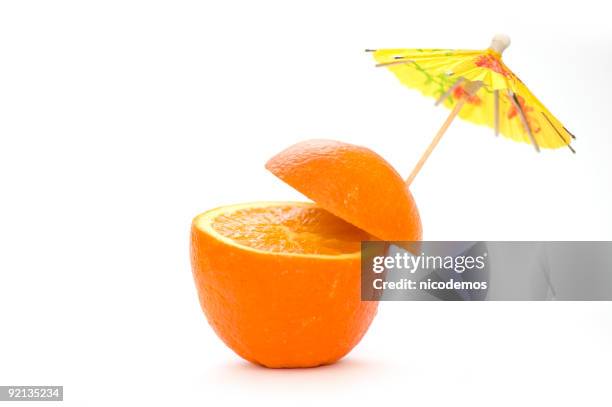 natural orange cocktail - drink umbrella stock pictures, royalty-free photos & images