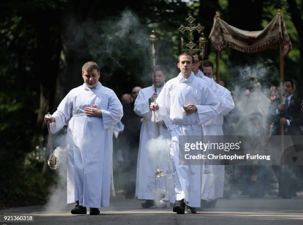Seminarians Benedetto D'Autilia and Matthew Roche-Saunders swing the incense burners during the Corpus Christi procession in honour of the Eucharist...