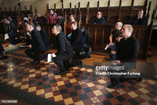 Seminarians and staff pray at the stations of the cross in the chapel of Oscott College during Easter services on April 14, 2014 in Birmingham,...