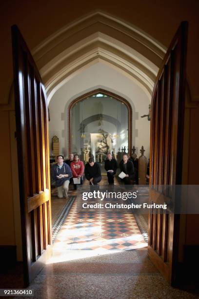 Seminarians and staff pray at the stations of the cross in the chapel of Oscott College during Easter services on April 14, 2014 in Birmingham,...