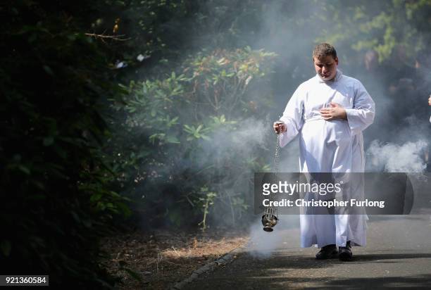 Seminarian Benedetto D'Autilia swings the incense burner during the Corpus Christi procession in honour of the Eucharist on June 22, 2014 in...