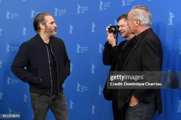 Gus Van Sant takes a photo of Joaquin Phoenix with Udo Kier nearby at the 'Don't Worry, He Won't Get Far on Foot' photo call during the 68th...