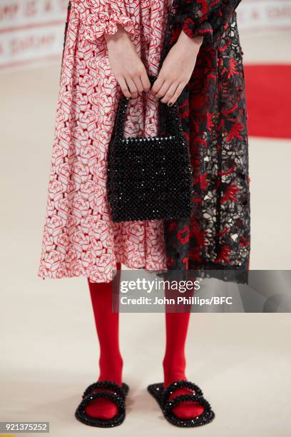 Model poses at the Shrimps Presentation during London Fashion Week February 2018 at TopShop Show Space on February 20, 2018 in London, England.