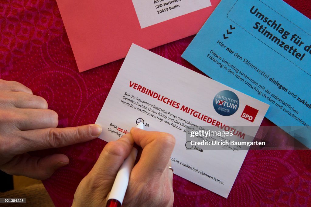 SPD members vote to form a grand coalition between the SPD and the CDU. Election ducuments and ballot paper