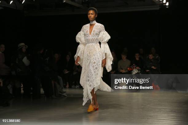 Model walks the catwalk at the Teatum Jones show during London Fashion Week February 2018 at BFC Show Space on February 20, 2018 in London, England.