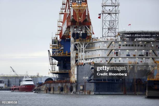 Construction cranes used in the offshore petroleum industry stand at Port Fourchon, Louisiana, U.S., on Thursday, Feb. 8, 2018. U.S. Oil explorers...