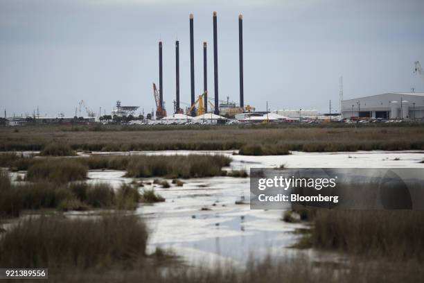 Petroleum industry support vessels and equipment stand in Port Fourchon, Louisiana, U.S., on Thursday, Feb. 8, 2018. U.S. Oil explorers added rigs...