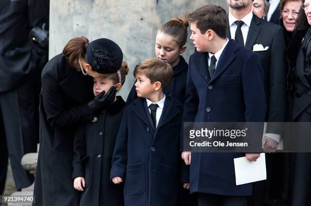 Crown Princess Mary comforts Princess Isabella while Prince Christian and Princess Josephine are look on during the funeral of Prince Henrik at the...