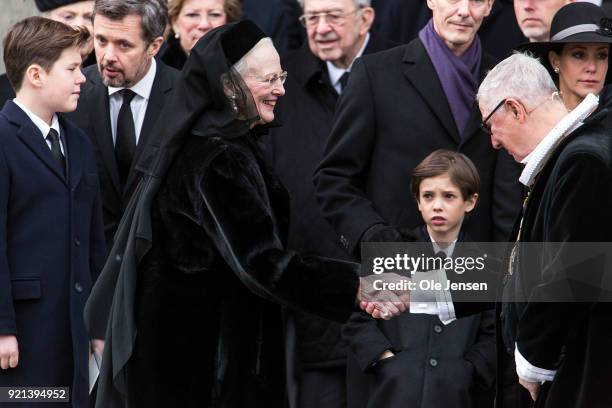 Queen Margrethe of Denmark thanks Royal priest Erik Nordmand Svendsen after the funeral service for Prince Henrik, at the Parliament Palace Church on...