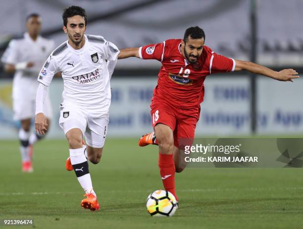 Persepolis' Mohsen Nodehi fights for the ball with al-Sadd Ali Thaimn during the AFC Champions League match al-Sadd vs Persepolis at the Jassim Bin...