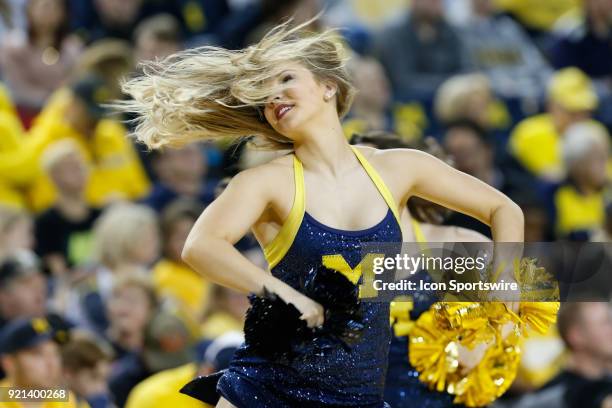 Member of the Michigan dance team performs during a timeout during a regular season Big 10 Conference basketball game between the Ohio State Buckeyes...